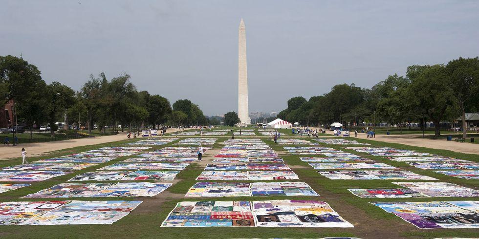 A photo of the AIDS memorial quilt, which is a large collection of hand made quilts filled with names of people who have passed away due to the virus.